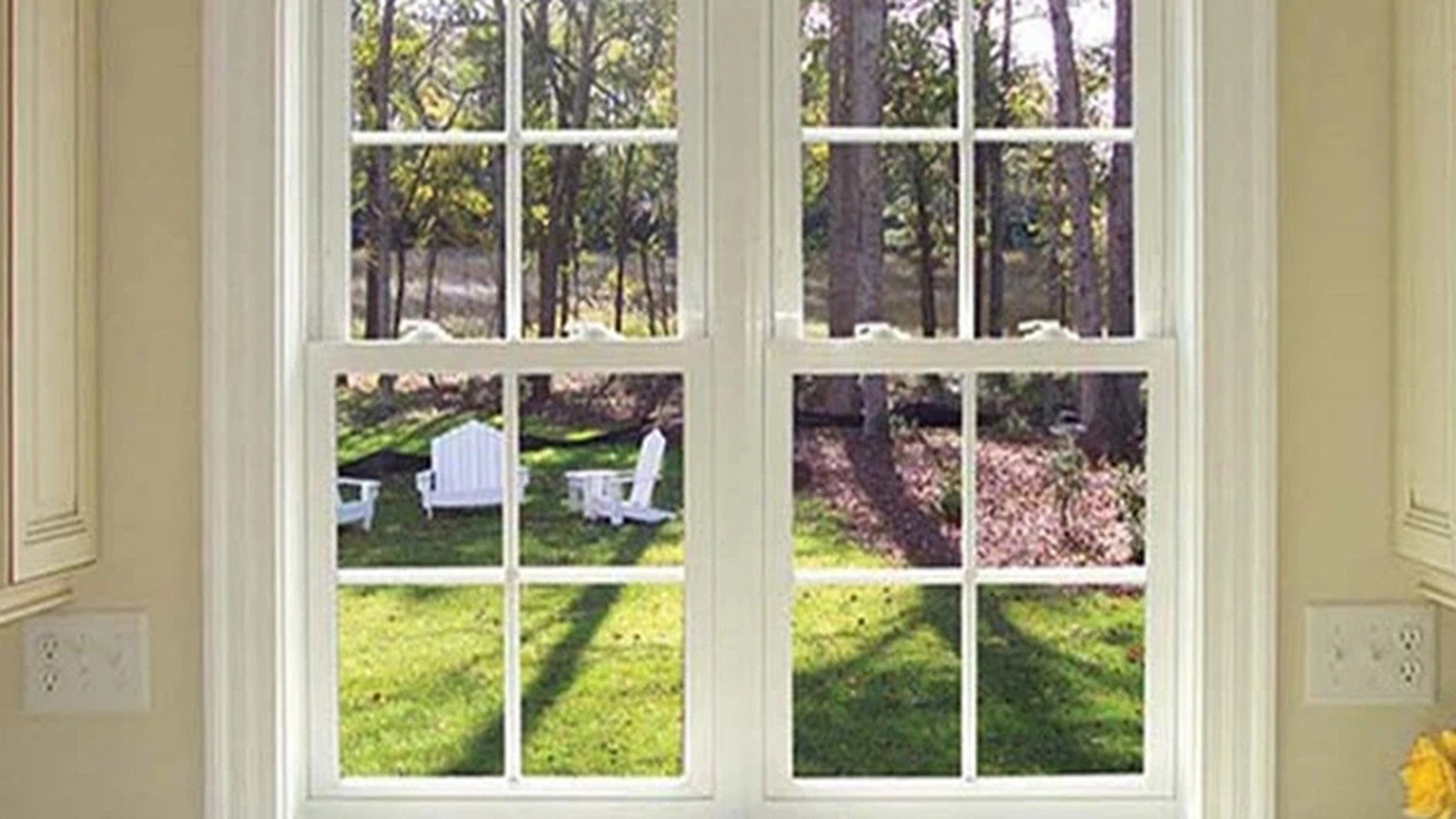 From inside, a pair of hung sashes side by side: the meeting rail sits at the same height in both units, which is the line a buyer checks first when two windows stand together.