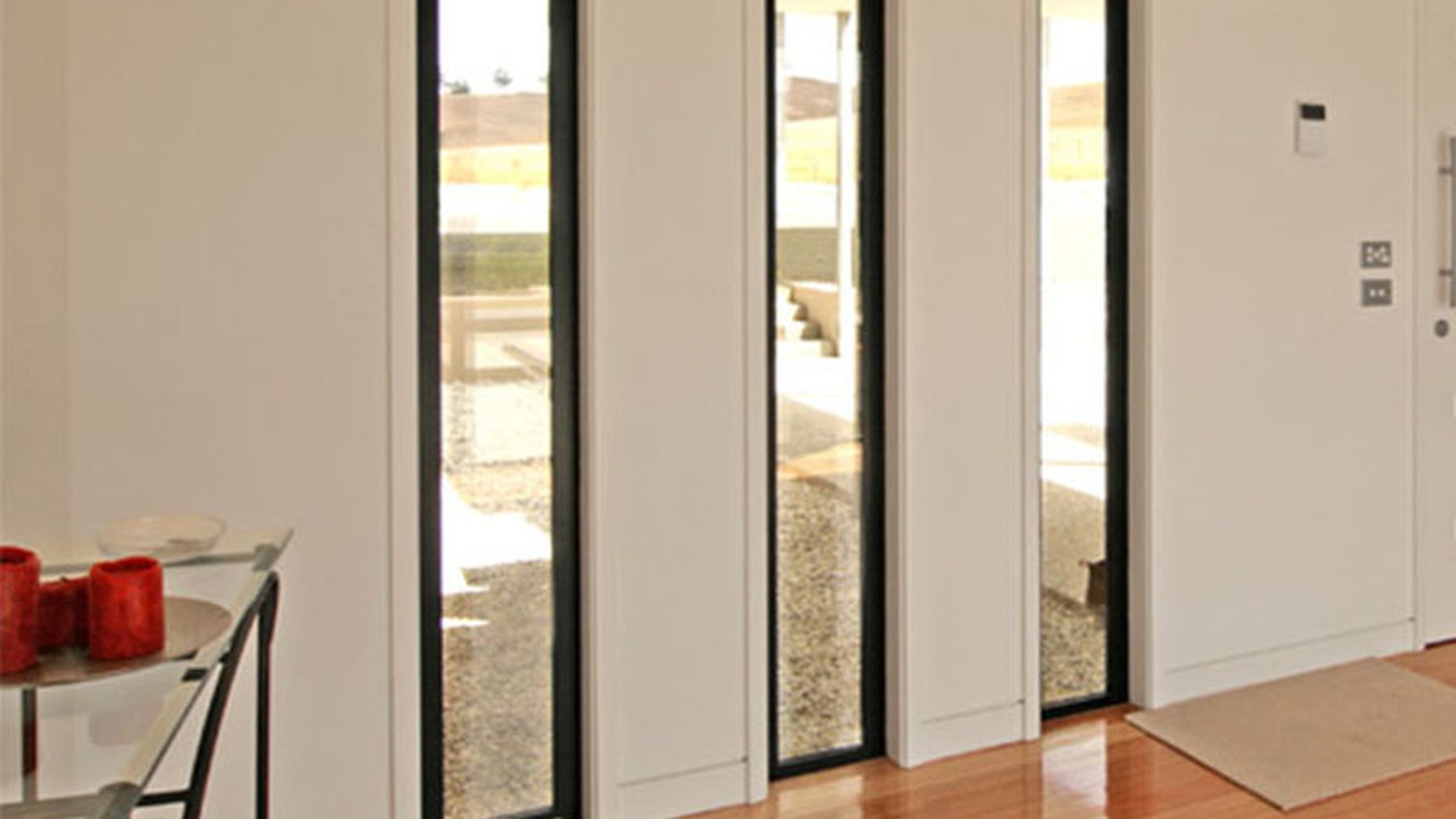 Full-height glazing beside a door: a sidelight is treated as part of the door assembly, so it is selected against the door rules, not the window rules.