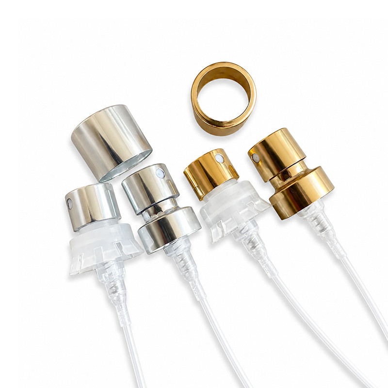 Screw-on aluminium perfume pump components in silver and gold finishes showing fine mist spray nozzles and threaded collars