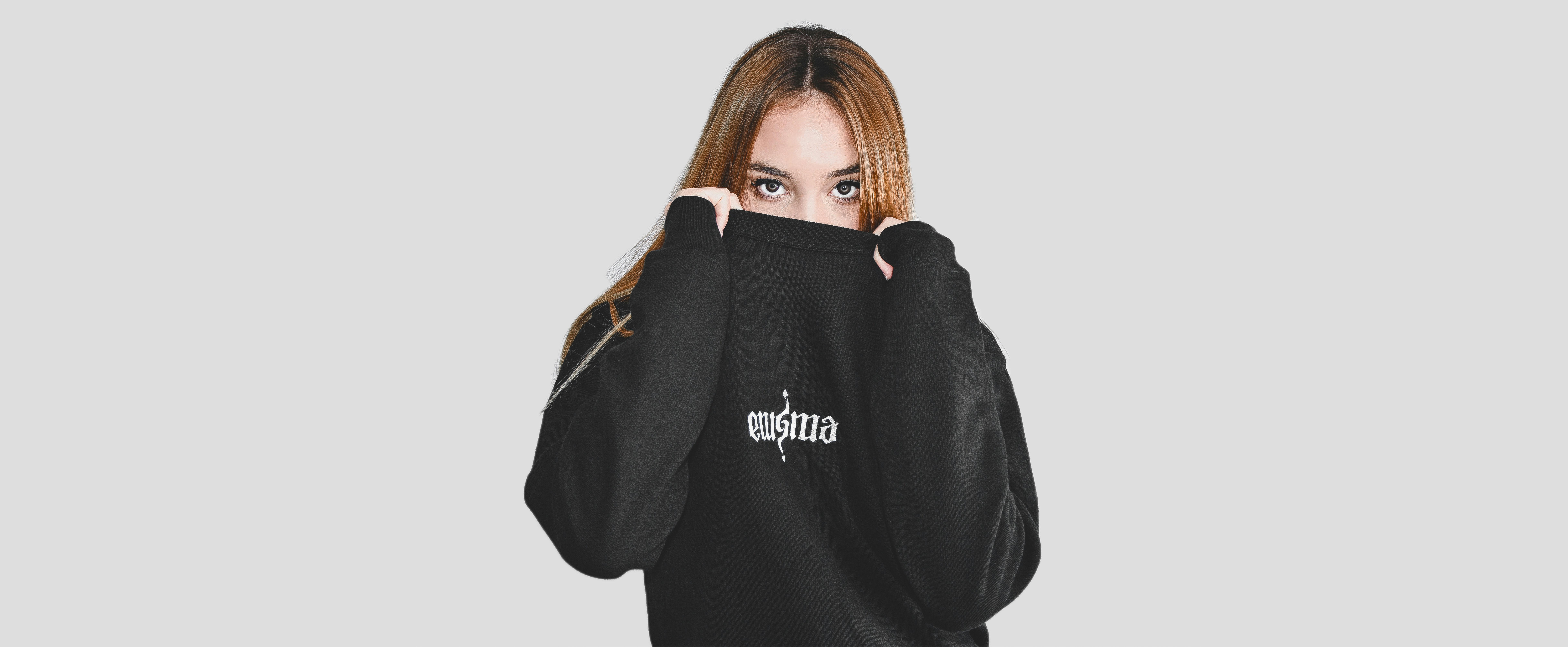 A collection of custom streetwear hoodies and t-shirts with bold graphics.