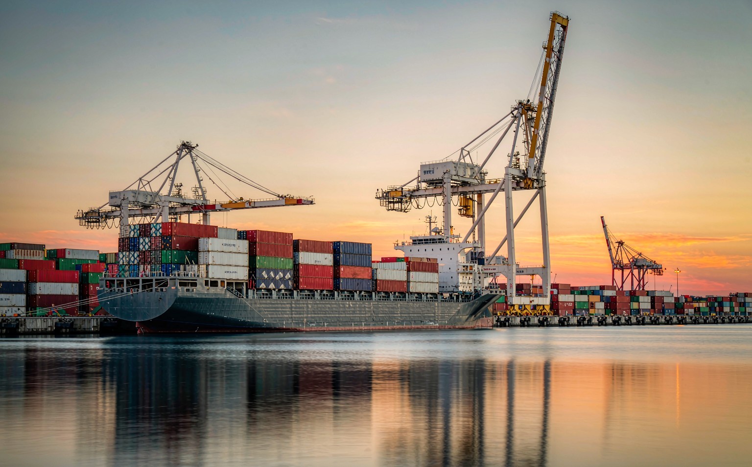 A container terminal with stacked boxes under dusk light