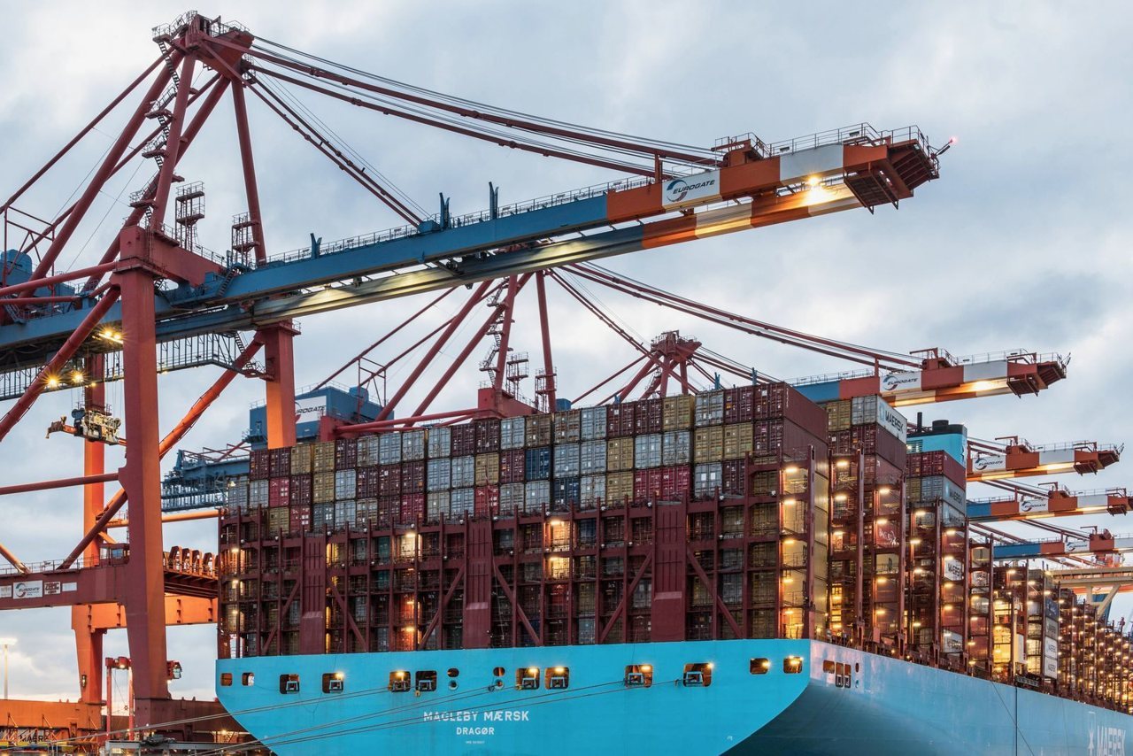 A consolidated shipment being palletised for bonded-warehouse fulfillment instead of thousands of individual parcels.