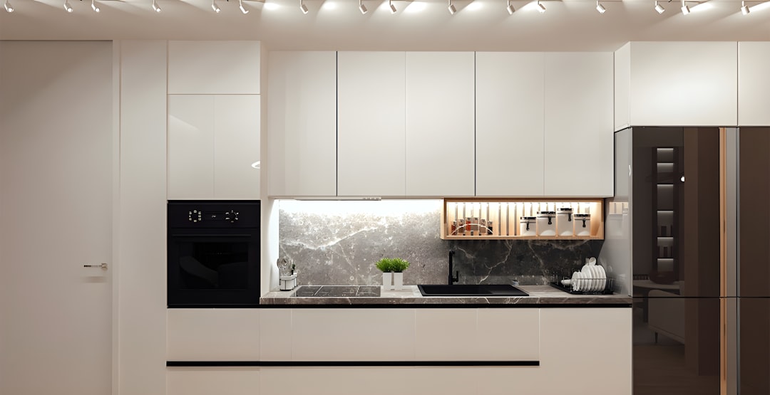 A sleek, slim wine cooler integrated into a modern kitchen.