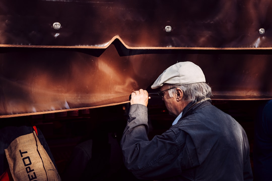 Craftsman inspecting the joinery of a modern humidor