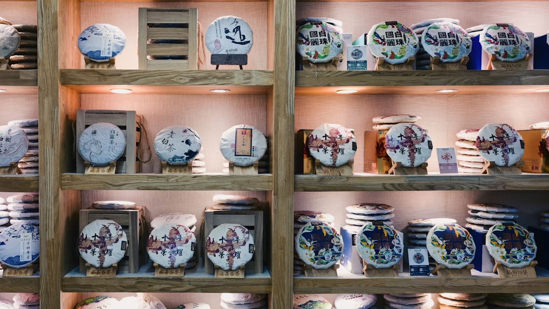 Close-up of a stainless steel wine cooler with wooden shelves