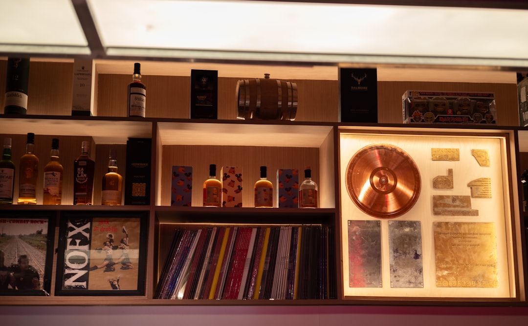 A well-organized wine cooler with wooden shelves and properly stored bottles