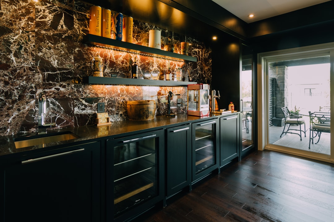 A stylish home bar with both a freestanding and a built-in wine cooler to showcase the difference