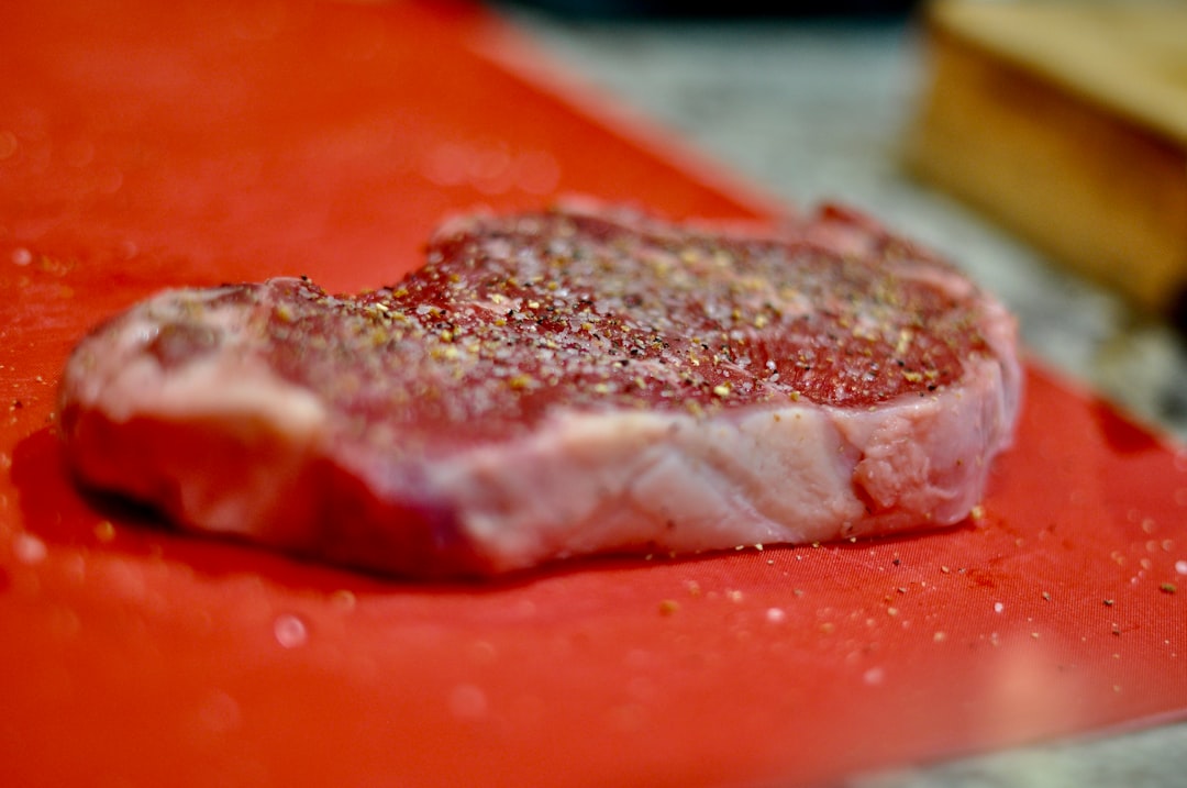 Close-up of a perfectly dry-aged ribeye steak showing its dark exterior and rich marbling