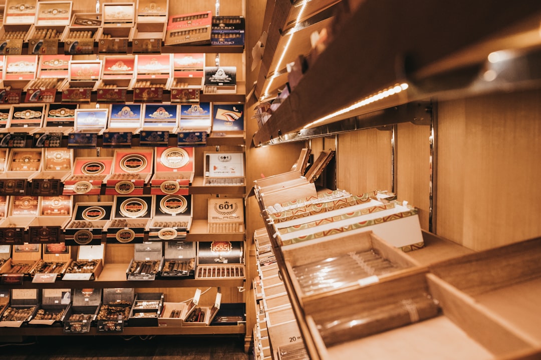 An assembly line showing electronic components being fitted into wooden humidor frames