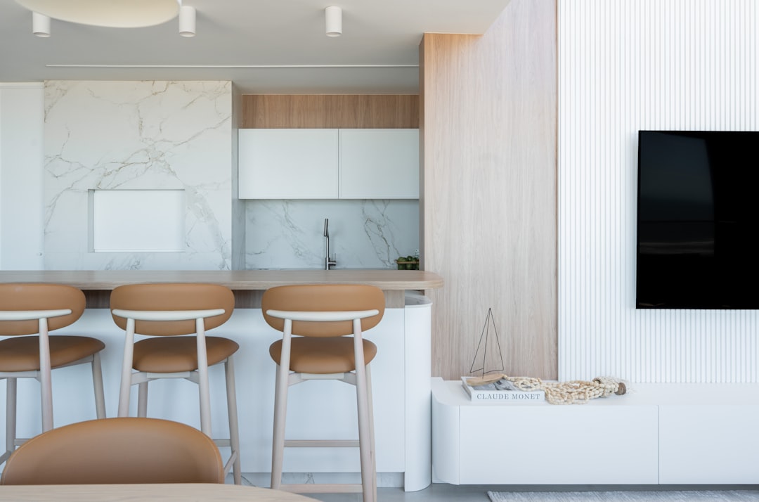 A stylish home wine cooler integrated into a modern kitchen bar area