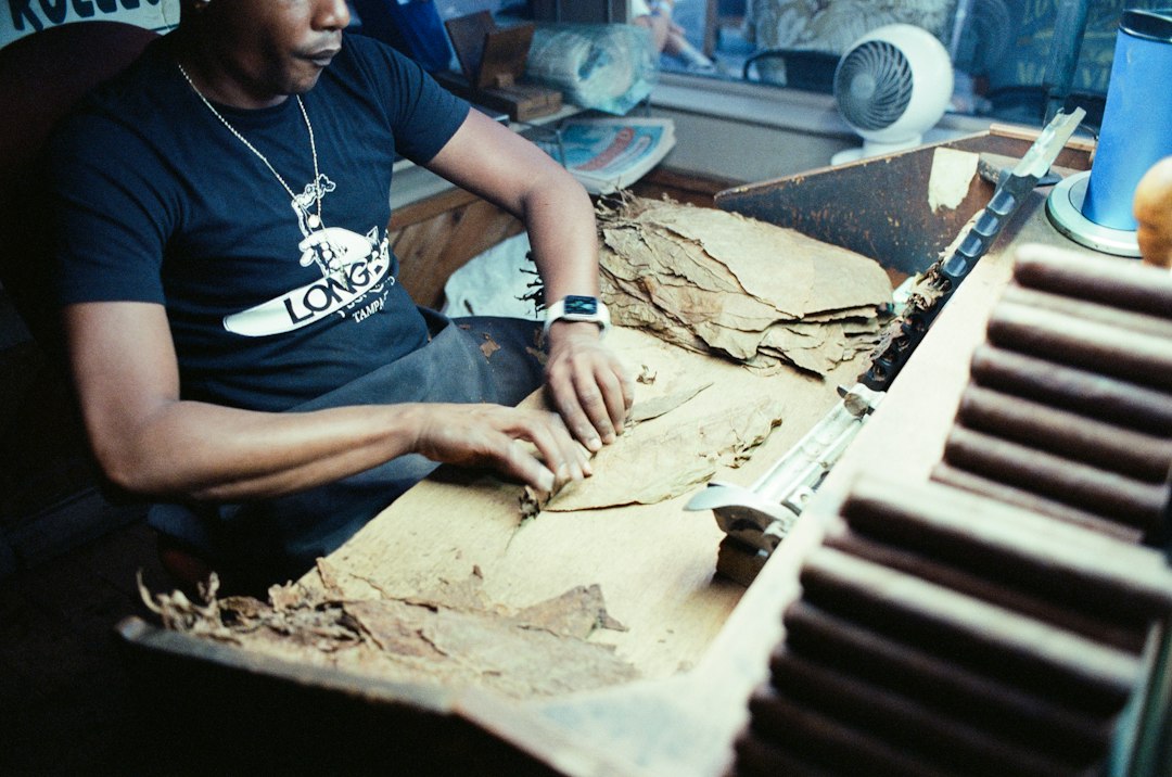 Craftsman inspecting the Spanish Cedar lining of a humidor