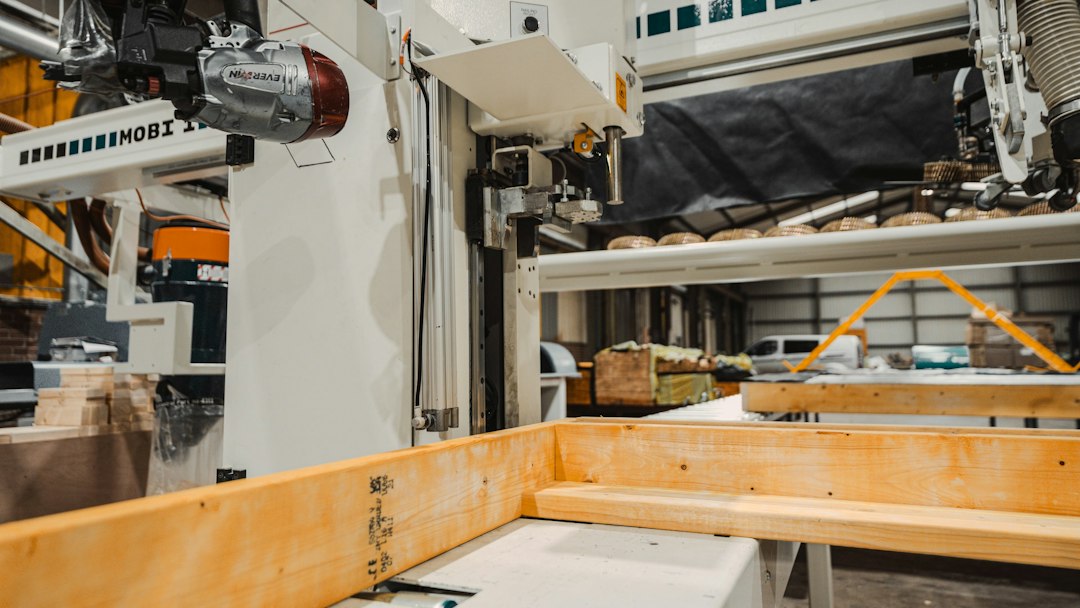 A modern, well-lit woodworking factory with efficient machinery