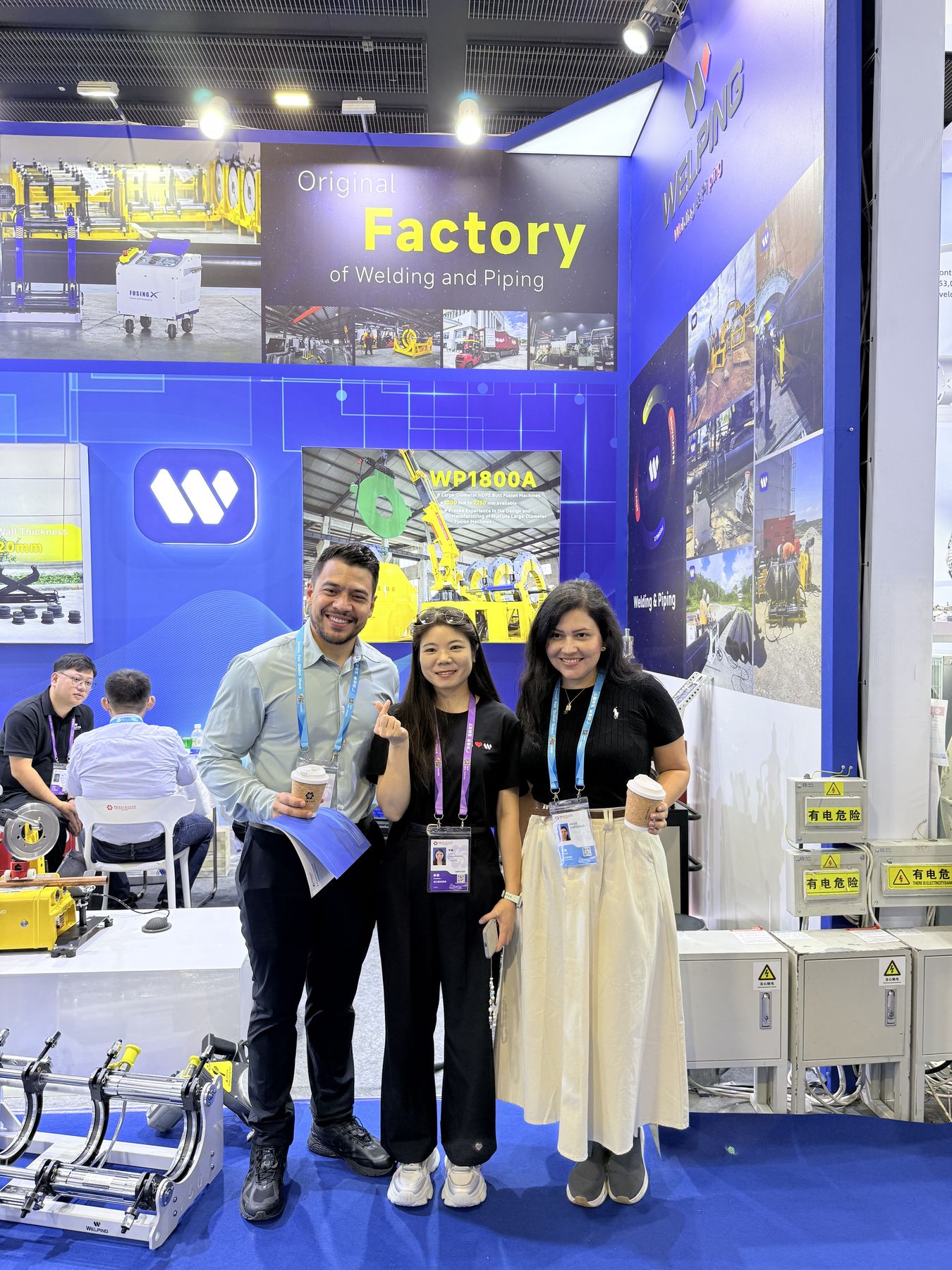 Welping team speaking with guests during the Canton Fair