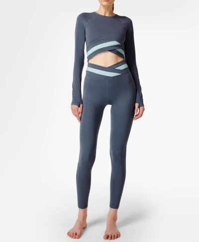 Women's yoga wear set classic round neck and long sleeves waist with visible wrap detail.