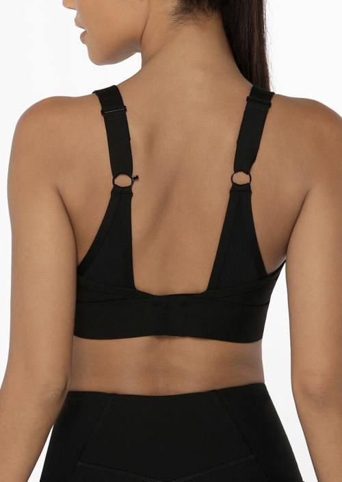 Versatile sports bra with zipper, adjustable straps, and clasp.
