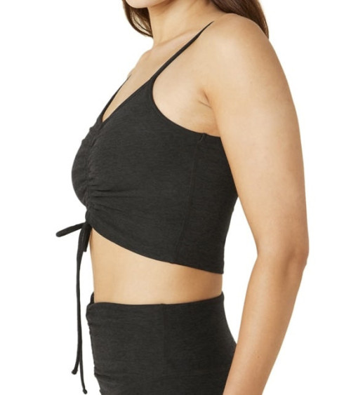 Yoga tank top has functional front chest wrinkles and an adjustable length that can be cut or extended to a long-line bra