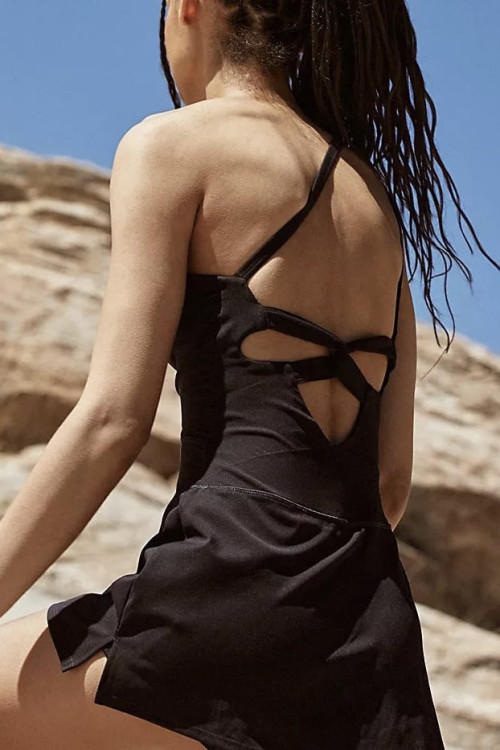 The one-shoulder jumpsuit has built-in performance shorts and a bold side cutout.