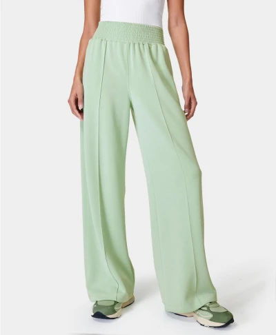 Women's high-waisted wide-leg track pant with pockets, soft fabrics