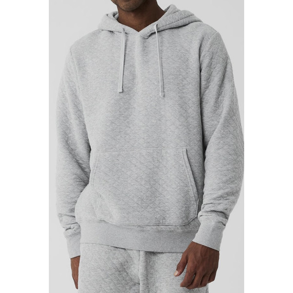 Men's hooded sweatshirt in quilted jacquard knit with front side kangaroo pockets for classic style.