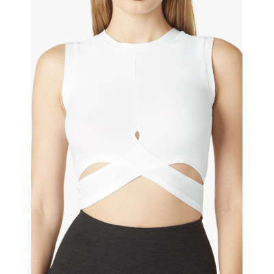 This breathable, form-fitting tank top is perfect for workouts or play, with crossover detailing to accentuate high-waisted bottoms
