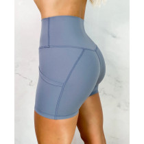 High waisted solid color biker shorts with pockets butt lifting yoga shorts