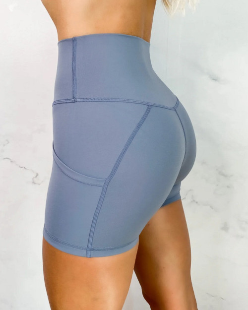 High waisted solid color biker shorts with pockets butt lifting yoga shorts