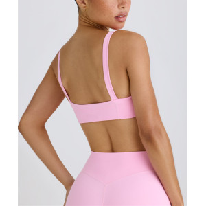Scoop neck padded sports bra with wide shoulder straps medium impact lower back yoga bralette