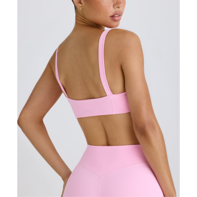 Scoop neck padded sports bra with wide shoulder straps medium impact lower back yoga bralette