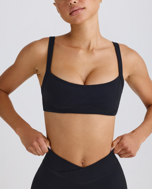 Scoop neck padded sports bra with wide shoulder straps medium impact lower back yoga bralette