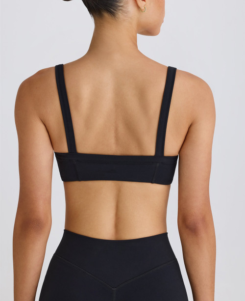 Scoop neck padded sports bra with wide shoulder straps medium impact lower back yoga bralette