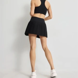 New arrival pleated tennis skort high waist flowy skirts with built in shorts