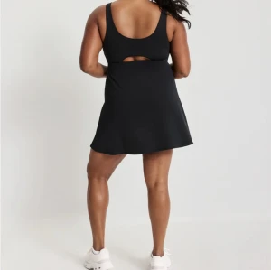Side slit one piece hollow out tennis dress with built in shorts