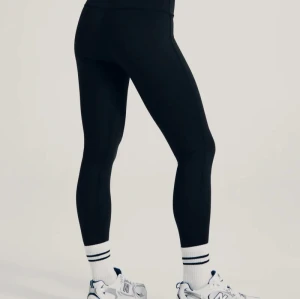 Mid rise compressive basic leggings for women squat proof stretchy yoga leggings