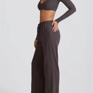 Women's mid rise adjustable waist wide leg pants athleisure style with side pockets