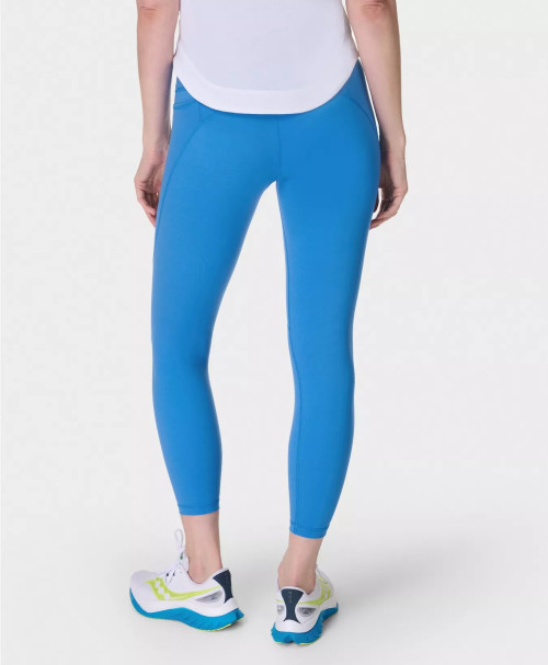 Women's mid rise compressive gym leggings with side pockets