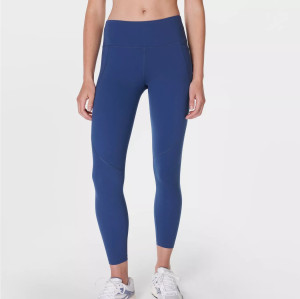 Women's mid rise compressive gym leggings with side pockets