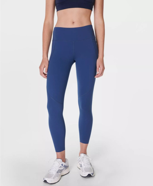 Women's mid rise compressive gym leggings with side pockets