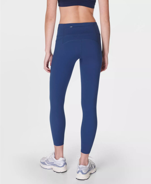 Women's mid rise compressive gym leggings with side pockets