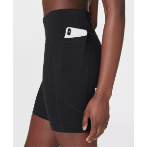 High waist running shorts with side pockets supportive mid length biker shorts