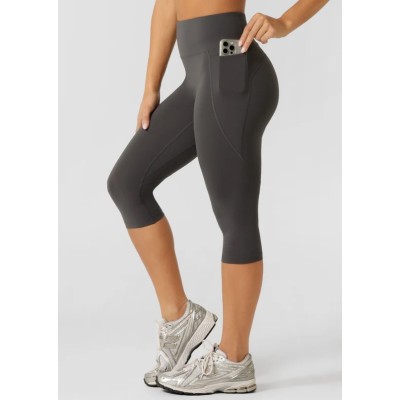 Tummy control compressive capris with side pockets flattering butt lifting fitness tights