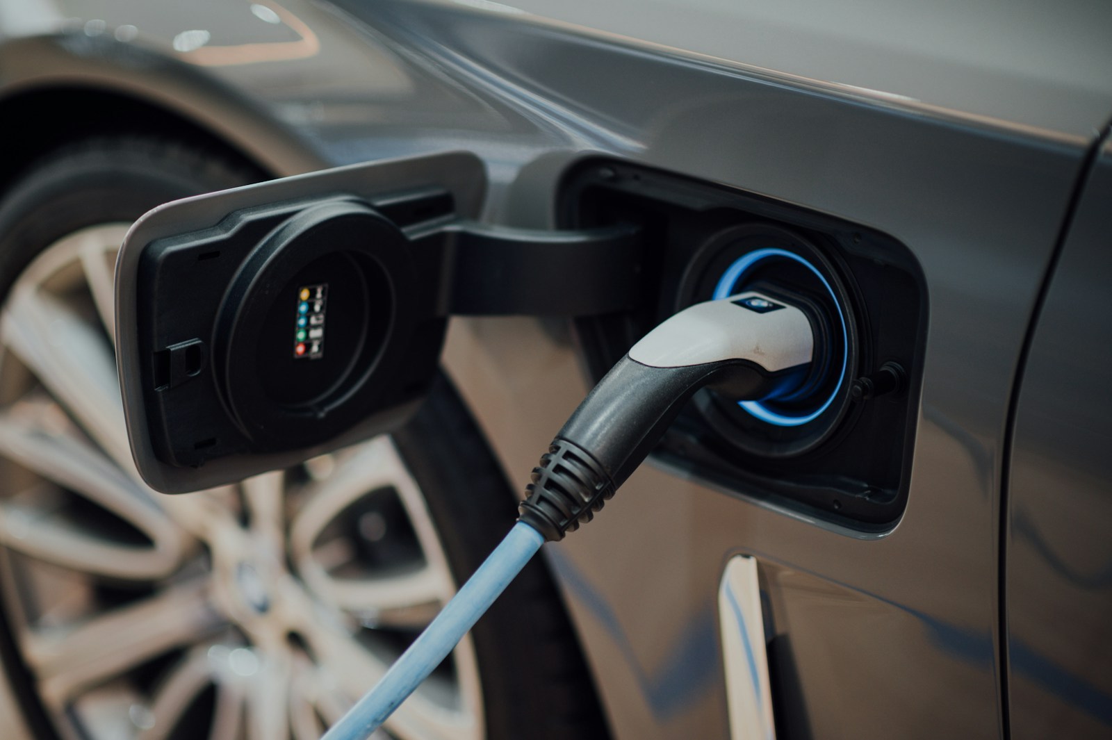 Electric vehicle charging cable connected to a new energy car