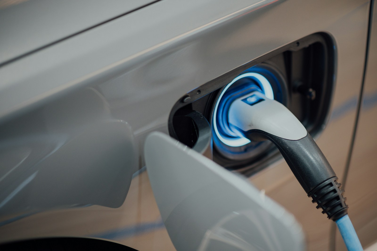 Close-up of an EV charging port being connected