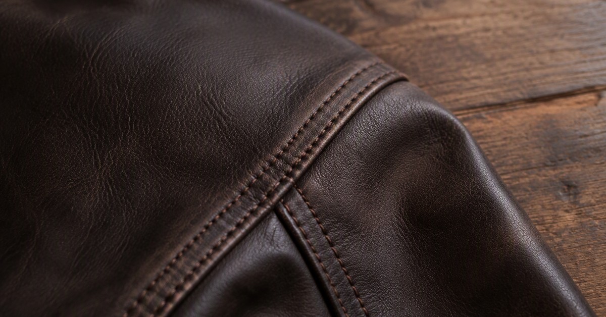 Repairable seam and topstitching on a dark brown leather jacket, showing construction details Danke documents for buyers