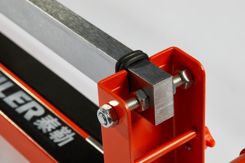 Close-up of a tile cutter guide rail system
