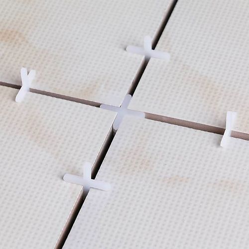 Tile joint spacing cross-section showing grout between porcelain tiles