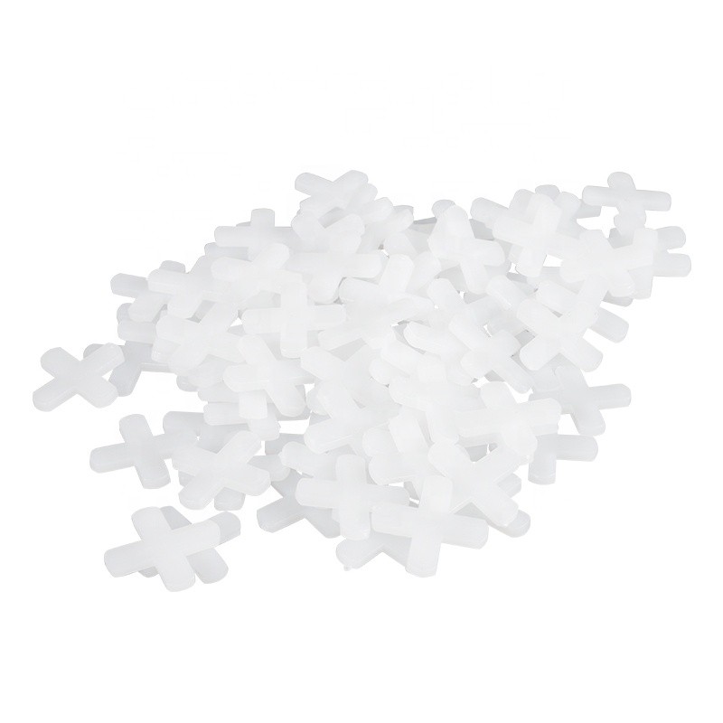 Various tile spacer types including cross spacers, T-shape spacers, and leveling wedges