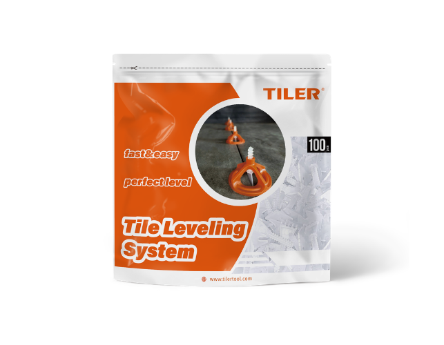 Screw-type tile leveling system components with orange handles and black bases