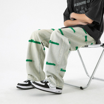 wholesale custom mens stacked jeans with chenille embroidery supplier | stacked jeans wholesale