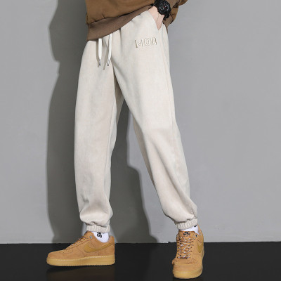 men in tight pants with plain embroidery | manufacturer clothing companies