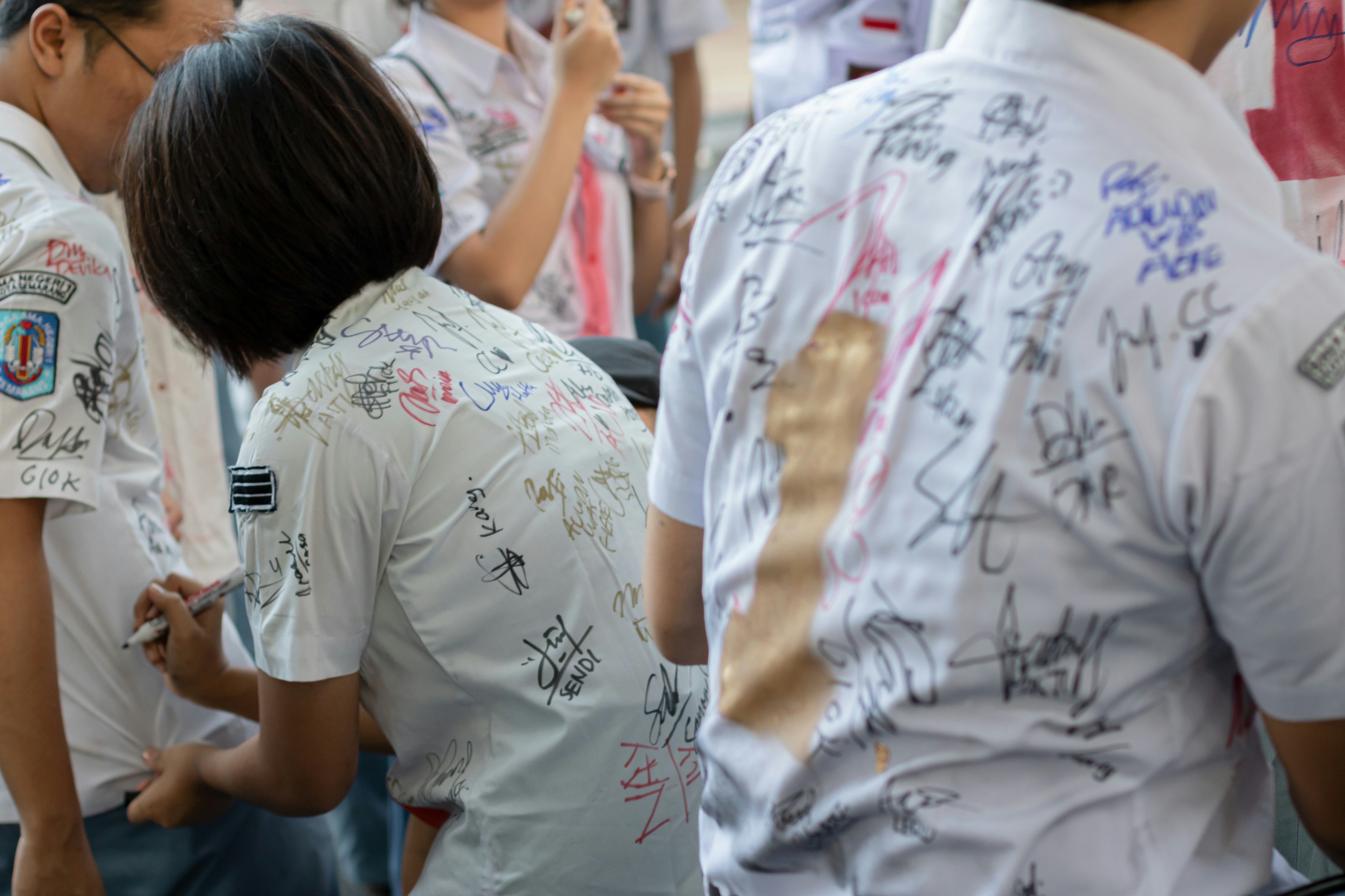 Participants in a charity run wearing matching custom t-shirts to support a cause.